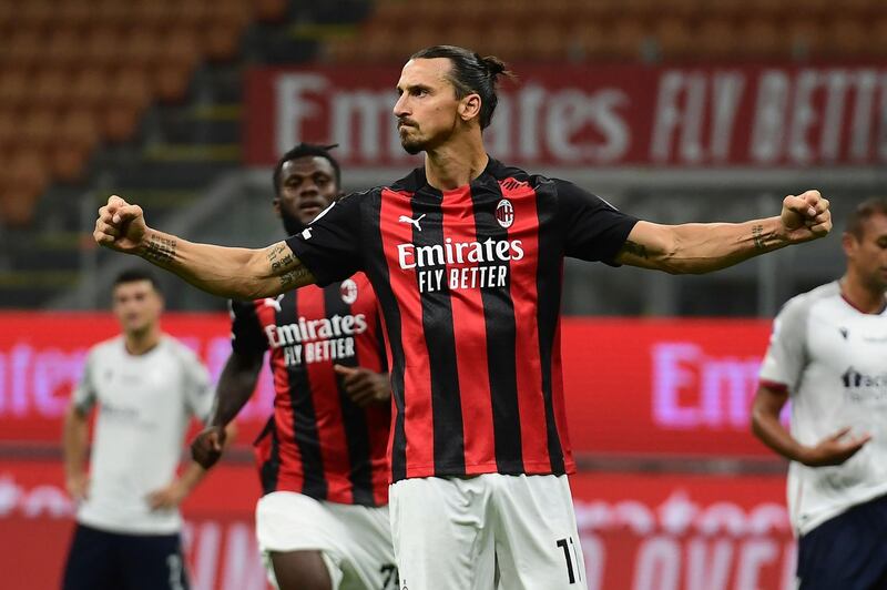 Zlatan Ibrahimovic celebrates after scoring AC Milan's second goal from the penalty spot during the  Serie A match against Bologna at the San Siro. AFP