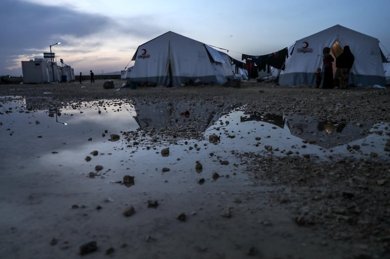 epa06756934 People gather near tents at a camp supported by the Turkish Red Crescent for people who were forcibly displaced from Eastern Ghouta, near al-Bel village, A'zaz city, north of Aleppo's countryside, Syria, 22 May 2018 (Issued 23 May 2018). ​Muslims around the world celebrate the holy month of Ramadan by praying during the night time and abstaining from eating, drinking, and sexual acts during the period between sunrise and sunset. Ramadan is the ninth month in the Islamic calendar and it is believed that the revelation of the first verse in Koran was during its last 10 nights.  EPA/MOHAMMED BADRA