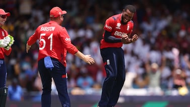 BRIDGETOWN, BARBADOS - JUNE 23: Chris Jordan of England celebrates the wicket of Saurabh Netravalkar of USA to complete a hat trick during the ICC Men's T20 Cricket World Cup West Indies & USA 2024 Super Eight match between USA and England at Kensington Oval on June 23, 2024 in Bridgetown, Barbados. (Photo by Robert Cianflone / Getty Images)