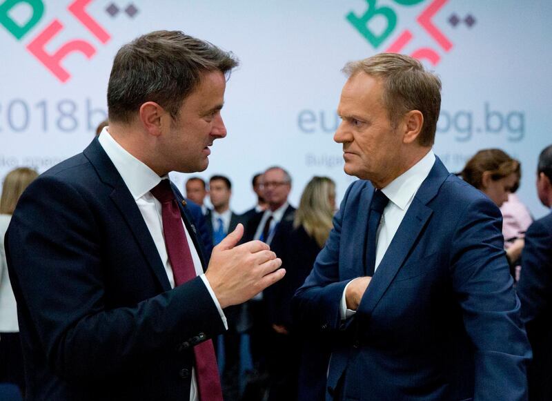 European Council President Donald Tusk (right) speaks with Luxembourg's Prime Minister Xavier Bettel during a round table meeting of EU and Western Balkan heads of state at the National Palace of Culture in Sofia on May 17, 2018. Virginia Mayo / AFP