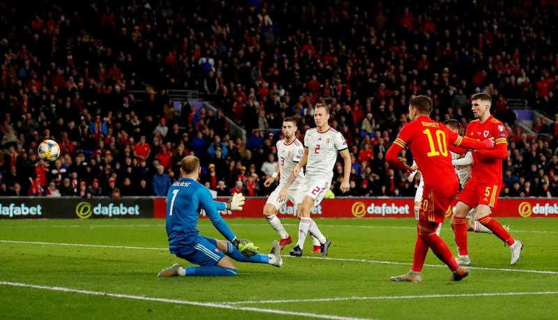 Aaron Ramsey of Wales scores his sides second goal. Reuters