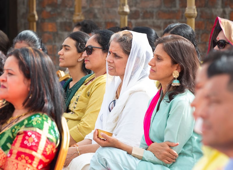 Residents, worshippers and officials join in chanting Sanskrit verses. 