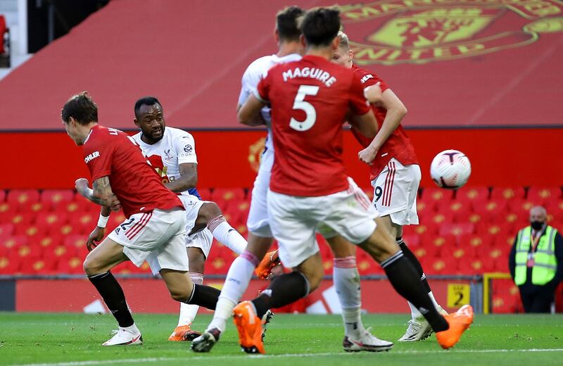 Crystal Palace's Jordan Ayew shoots at goal but his effort  is saved by Manchester United goalkeeper David de Gea. PA