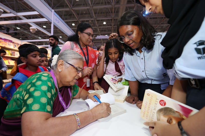 Author Sudha Murty signs books at the festival. Photo: Chris Whiteoak / The National
