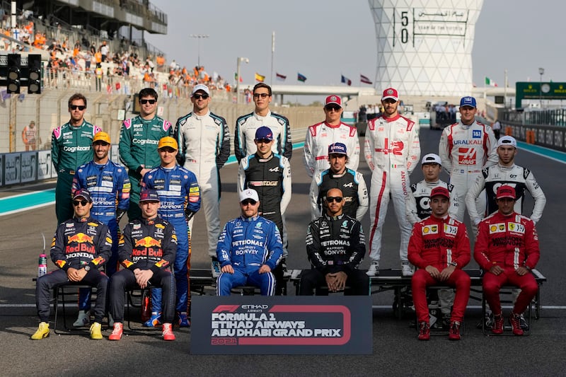 Drivers pose for their end-of-season picture before the Abu Dhabi Grand Prix. AP