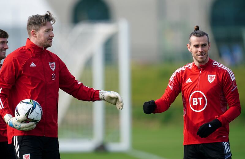 Wales goalkeeper Wayne Hennessey with Gareth Bale. PA