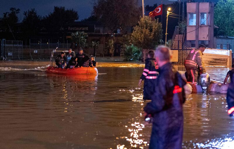 People are rescued and evacuated by boats during flooding of Kucukcekmece district in Istanbul.  AFP