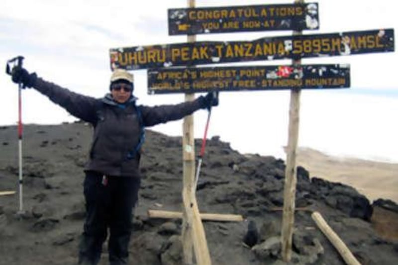 "Congratulations, you are now at Uhuru Peak Tanzania 5,895m. Africa's Highest Point. World's Highest Free-Standing Mountain.