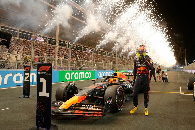 Red Bull driver Sergio Perez of Mexico enjoys that winning feeling after crossing the line first in the Saudi Arabian Grand Prix in Jeddah. AP