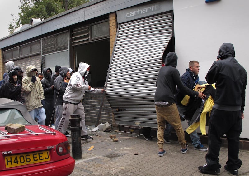 Rioters loot a Carhartt store in Hackney.