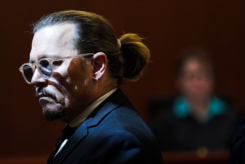 Depp gets up during a break in the courtroom on Wednesday. AP