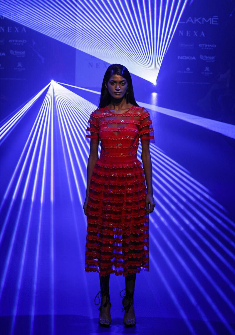 A model presents an outfit by designers Pankaj and Nidhi. EPA