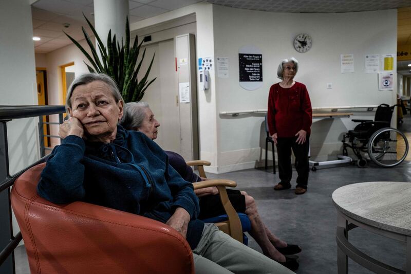 Elderly residents gather in a common area at The Vilanova Care Home in Corbas, south-eastern France on October 1. Jeff Pachoud / AFP