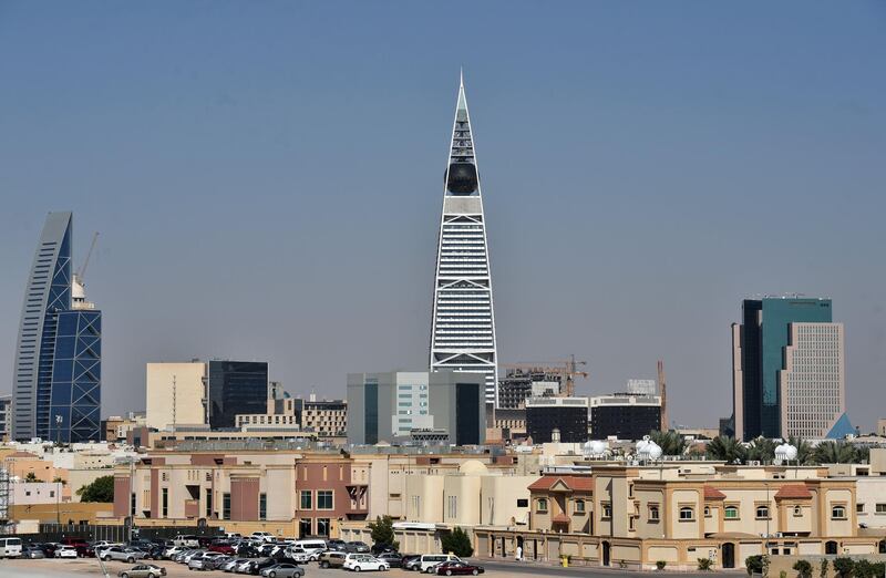 The Faisaliya tower stands among other buildings in the Saudi capital Riyadh on December 5, 2019. / AFP / FAYEZ NURELDINE
