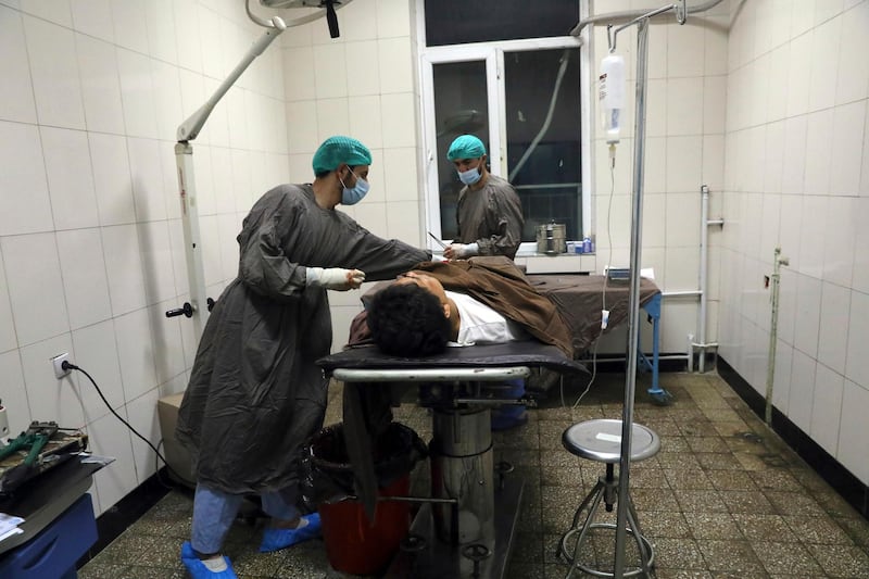 A man is treated at a hospital after a deadly attack at Kabul University, in Kabul. AP Photo