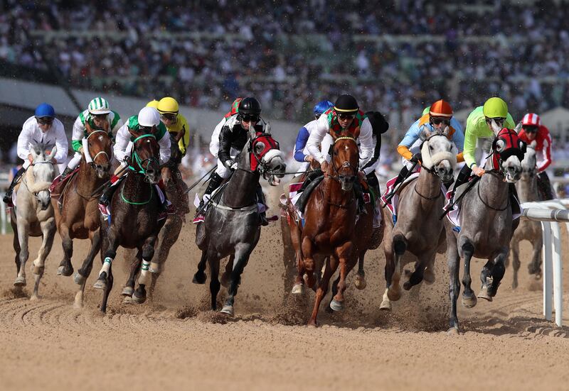 First Classs, second right, ridden by Ronan Thomas, wins the Dubai Kahayla Classic. Chris Whiteoak / The National