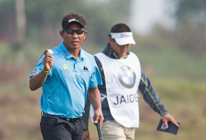 Thongchai Jaidee holds a one-shot lead heading into the final round of the BMW Masters in Shanghai. Johannes Eisele / AFP 

 