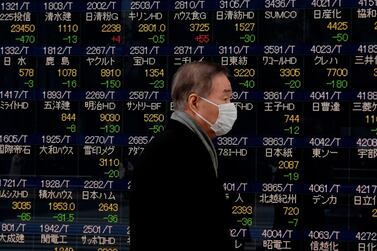 Asian shares rose to record highs on Friday, with Japan's Nikkei hitting a three-decade peak . / AFP PHOTO / Kazuhiro NOGI