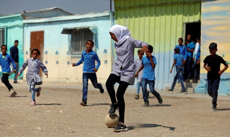 Palestinian students play soccer at their school in Jordan Valley in the Israeli-occupied West Bank.  Reuters