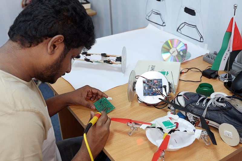 Arun Kumar, Junkbot's chief software architect, works on a robot. Satish Kumar / The National