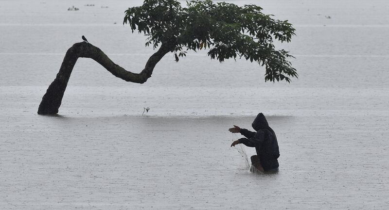 A man out fishing in Assam. EPA