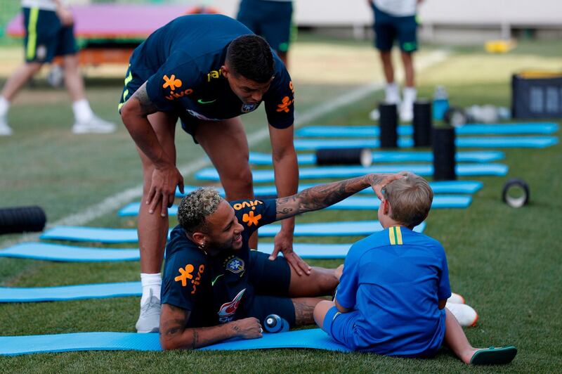 Neymar jokes with his son Davi Lucca. Adrian Dennis / AFP