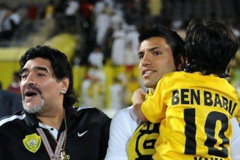 Diego Maradona, left, has brought global attention to Al Wasl. Last night he was joined by his son in law, Manchester City's Sergio Aguero, centre, and his grandson Benjamin.