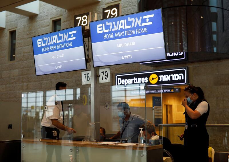 Screens displaying flight number LY971 to Abu Dhabi at Tel Aviv airport. Reuters