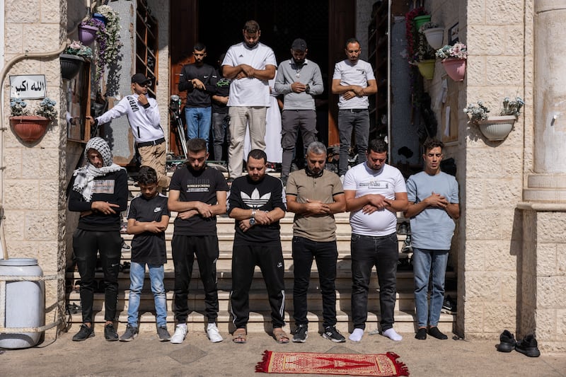 Prayers at the funeral of the men killed in the Israeli raid