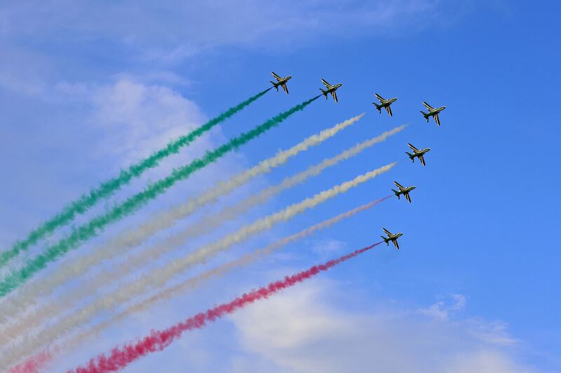Smoke from the aircraft in the colours of the Kuwait flag