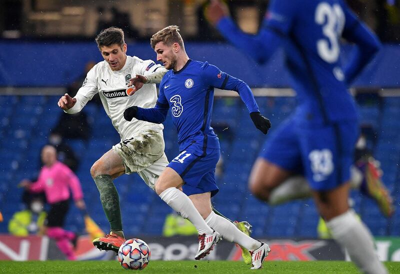 FK Krasnodar's Belarus defender Aleksandr Martynovich (L) vies with Chelsea's German striker Timo Werner during the UEFA Champions League Group E football match between Chelsea and FK Krasnodar at Stamford Bridge in London on December 8, 2020. (Photo by Ben STANSALL / AFP)