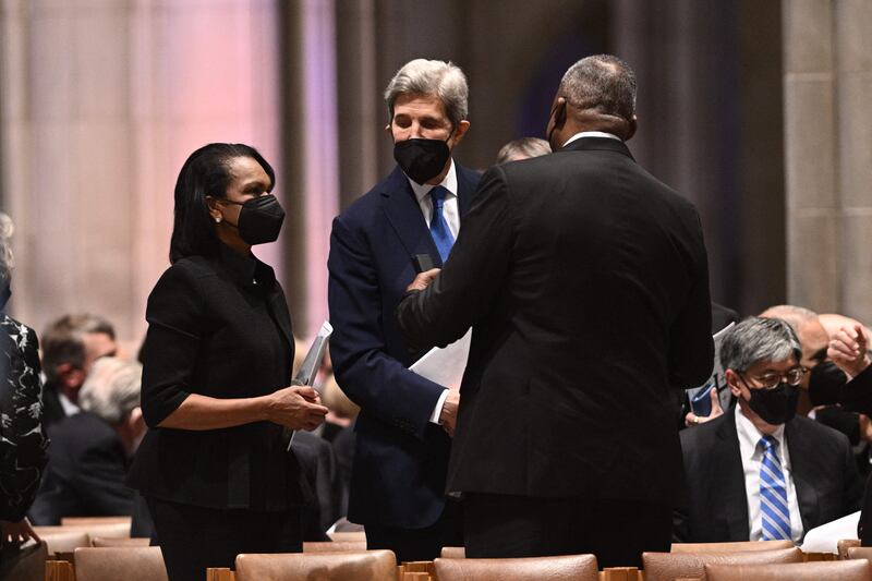 Former secretary of state Condoleezza Rice speaks with US climate envoy John Kerry and Defence Secretary Lloyd Austin. AFP