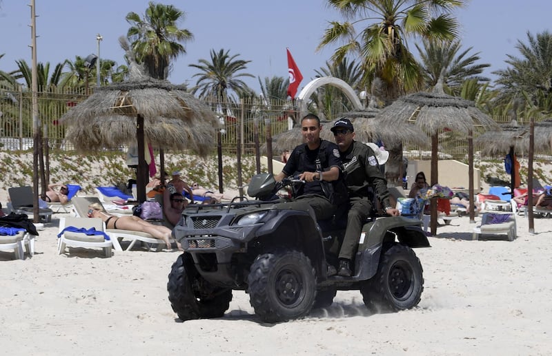 Tunisian police patrol a beach in the Tunisian Mediterranean resort of Sousse. With its economy hit hard by the pandemic, Tunisia is counting on Russians and eastern Europeans to salvage its tourist sector whose employees fear hunger more than Covid-19. AFP