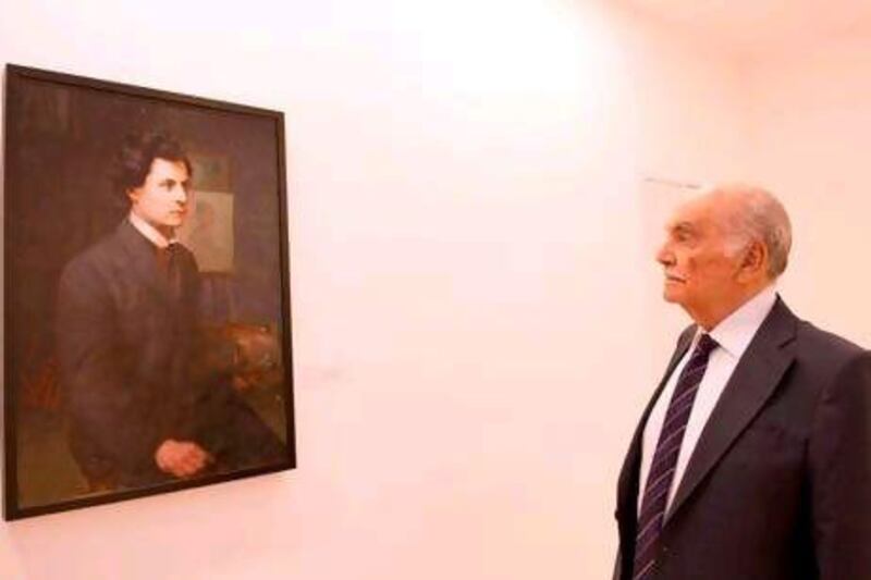 Dr Samir Saleeby admires his relative's self-portrait, one of 59 paintings (of which 31 works are by Khalil Saleeby) and four watercolours he has gifted to the American University of Beirut. Ahmad El A Itani