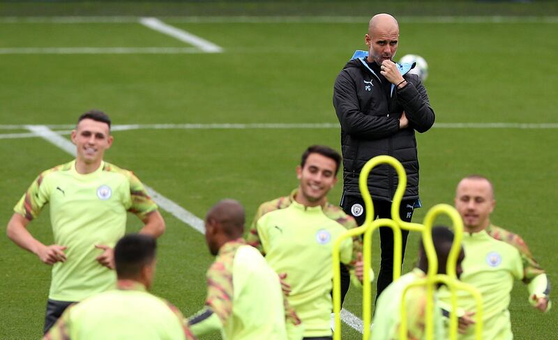 Manchester City manager Pep Guardiola oversees  Manchester City training on Monday. PA