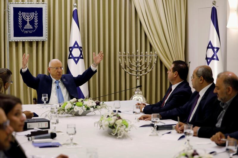 FILE PHOTO: Memebers of the  Joint List party sits next to Israeli President Reuven Rivlin as he began talks with political parties over who should form a new government, at his residence in Jerusalem September 22, 2019. Menachen Kahana/Pool via REUTERS/File Photo