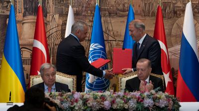 Turkish President Recep Tayyip Erdogan, right, and UN Secretary General Antonio Guterres lead a signing ceremony at Dolmabahce Palace in Istanbul last July. AP Photo