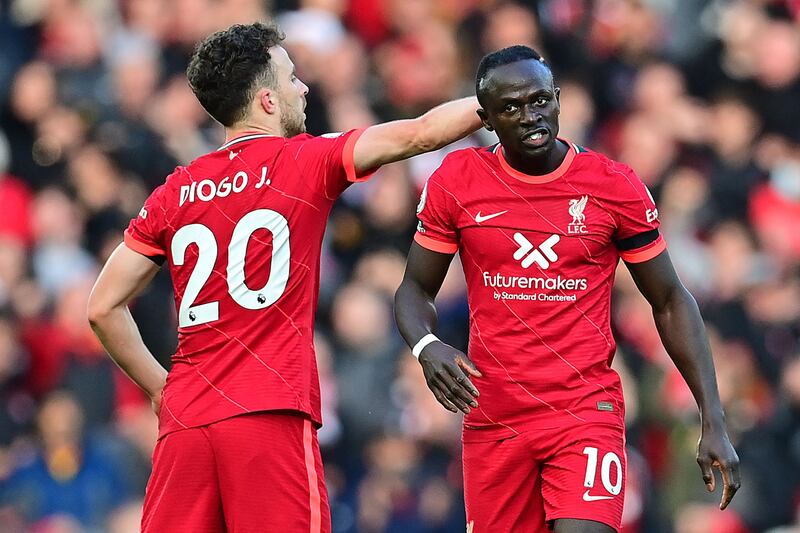 Liverpool striker Sadio Mane celebrates with Diogo Jota after scoring. AFP