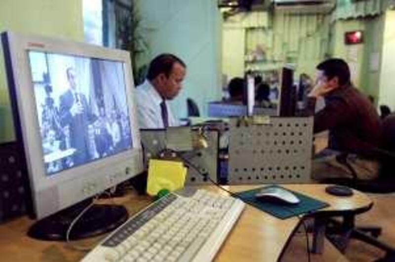 A computer screen shows Gamal Mubarak, son of Egyptian President Hosni Mubarak and head of the leading NDP party, speaking on a panel on a web stream in an internet cafe in Cairo.