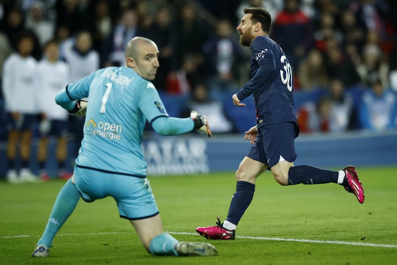 Lionel Messi celebrates scoring at Parc des Princes. EPA