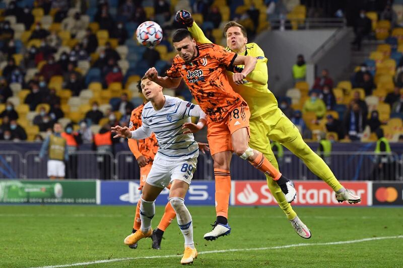 Juventus goalkeeper Wojciech Szczesny attempts to punch clear. AFP