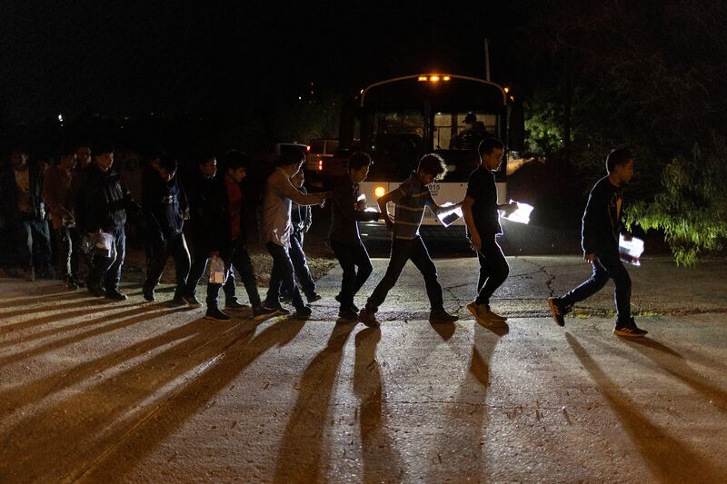 Central American migrant boys prepare to board a Customs and Border Protection bus after crossing the Rio Grande into the US from Mexico in Roma, Texas. Reuters