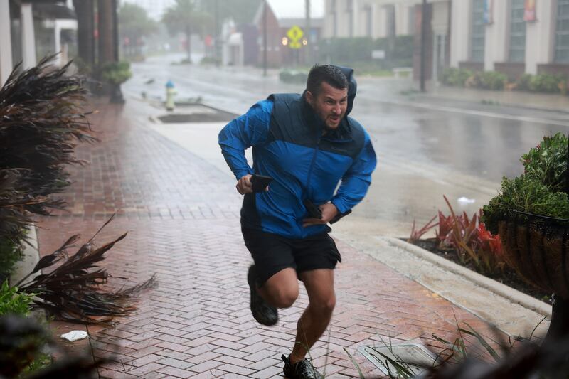 Brent Shaynore runs for cover. AFP