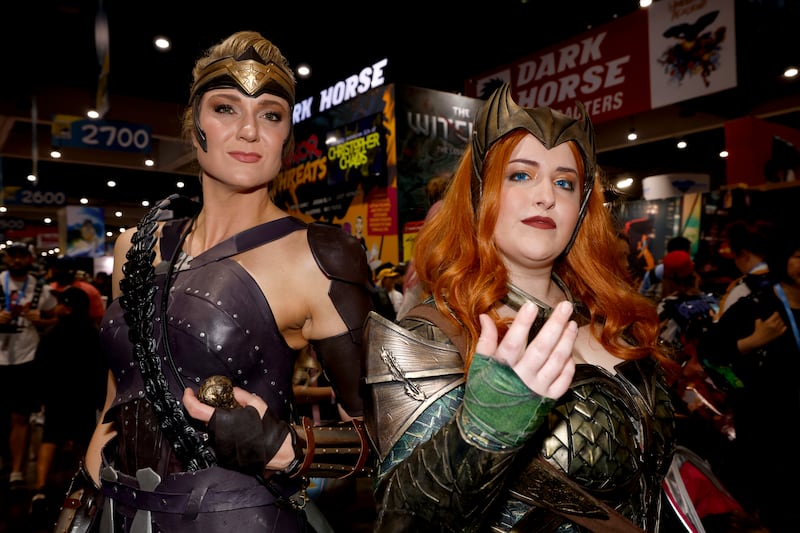 From left, Susie Cramer as Antiope from Wonder Woman and Morgan Duhon as Mera from Aquaman. AP