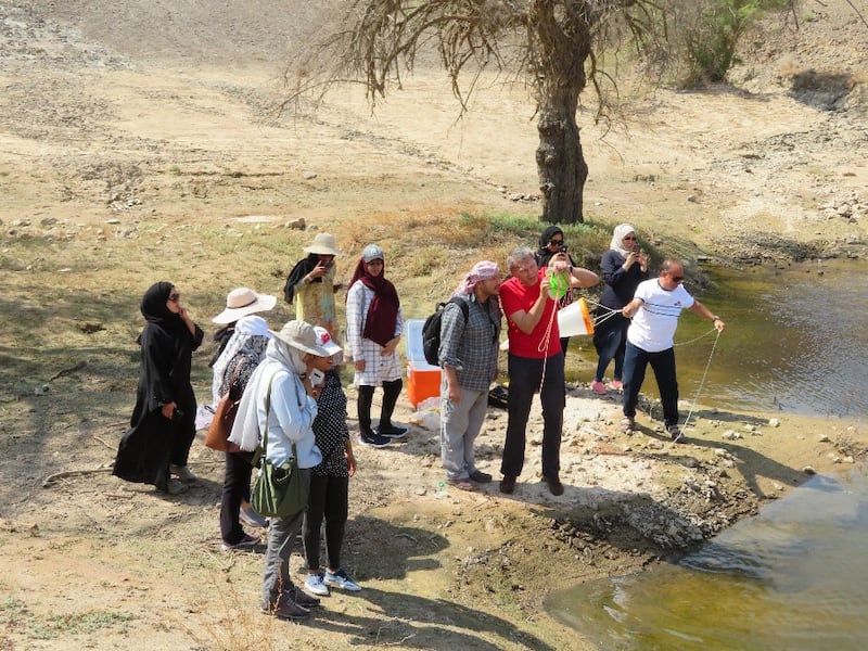 Researchers collecting mud and water samples, and the areas of water in the UAE where they took samples. Photo: Prof Waleed Hamza