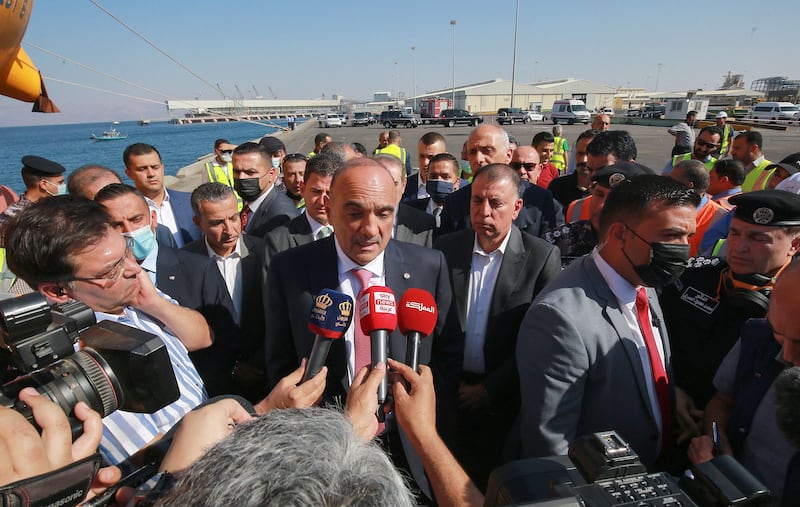 Jordanian Prime Minister Bisher Al Khasawneh talks to reporters as he visits the scene. AFP