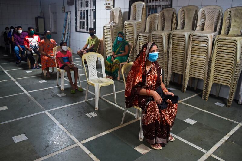 People wait for their turn at a coronavirus testing centre in Mumbai on July 17, 2020. AFP