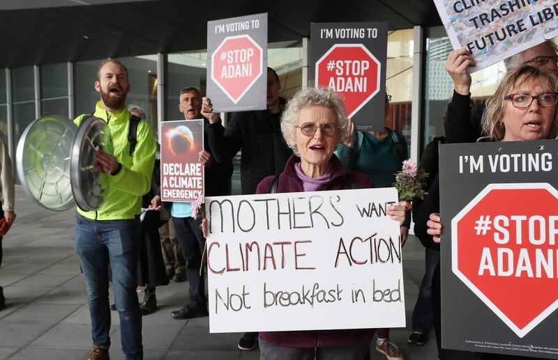 Anti Adani coal mine protesters hold a demonstration outside the Liberal Party campaign launch for the 2019 Federal election at the Melbourne Convention Centre. EPA