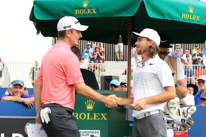 DUBAI, UNITED ARAB EMIRATES - NOVEMBER 16:  Justin Rose of England shakes hands with Tommy Fleetwood of England (R) on the 1st tee during the first round of the DP World Tour Championship at Jumeirah Golf Estates on November 16, 2017 in Dubai, United Arab Emirates.  (Photo by Andrew Redington/Getty Images)