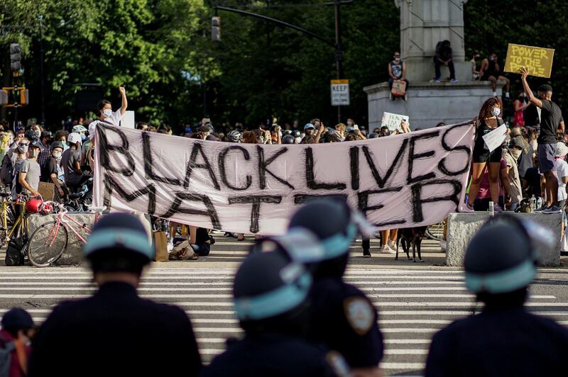 Demonstrators hold a Black Lives Matter banner  in Brooklyn, New York City. Reuters